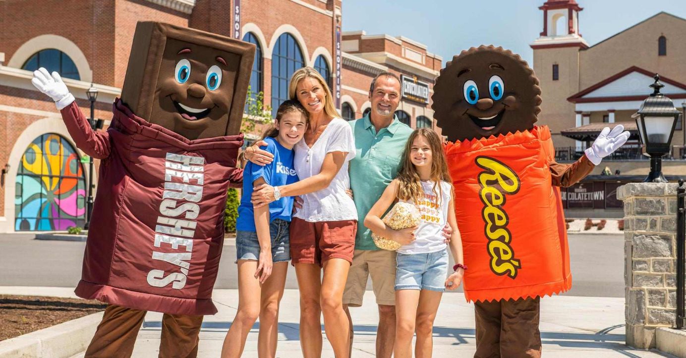 family at Hersheypark with Hershey characters